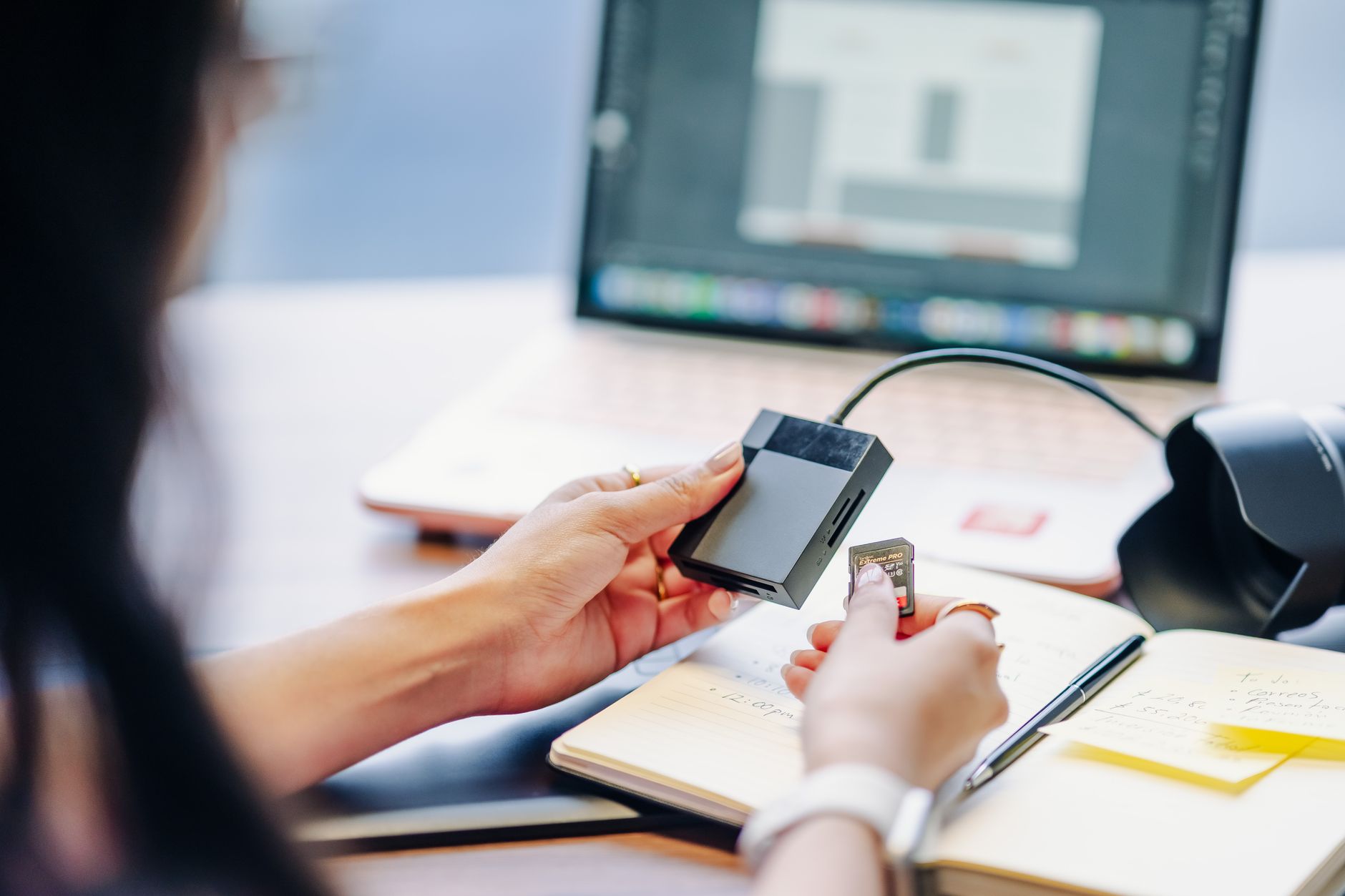 Unleash Power, Save Space: The Best Mini PCs of 2026 9 A person connecting cables to a new compact mini PC on a clean desk.