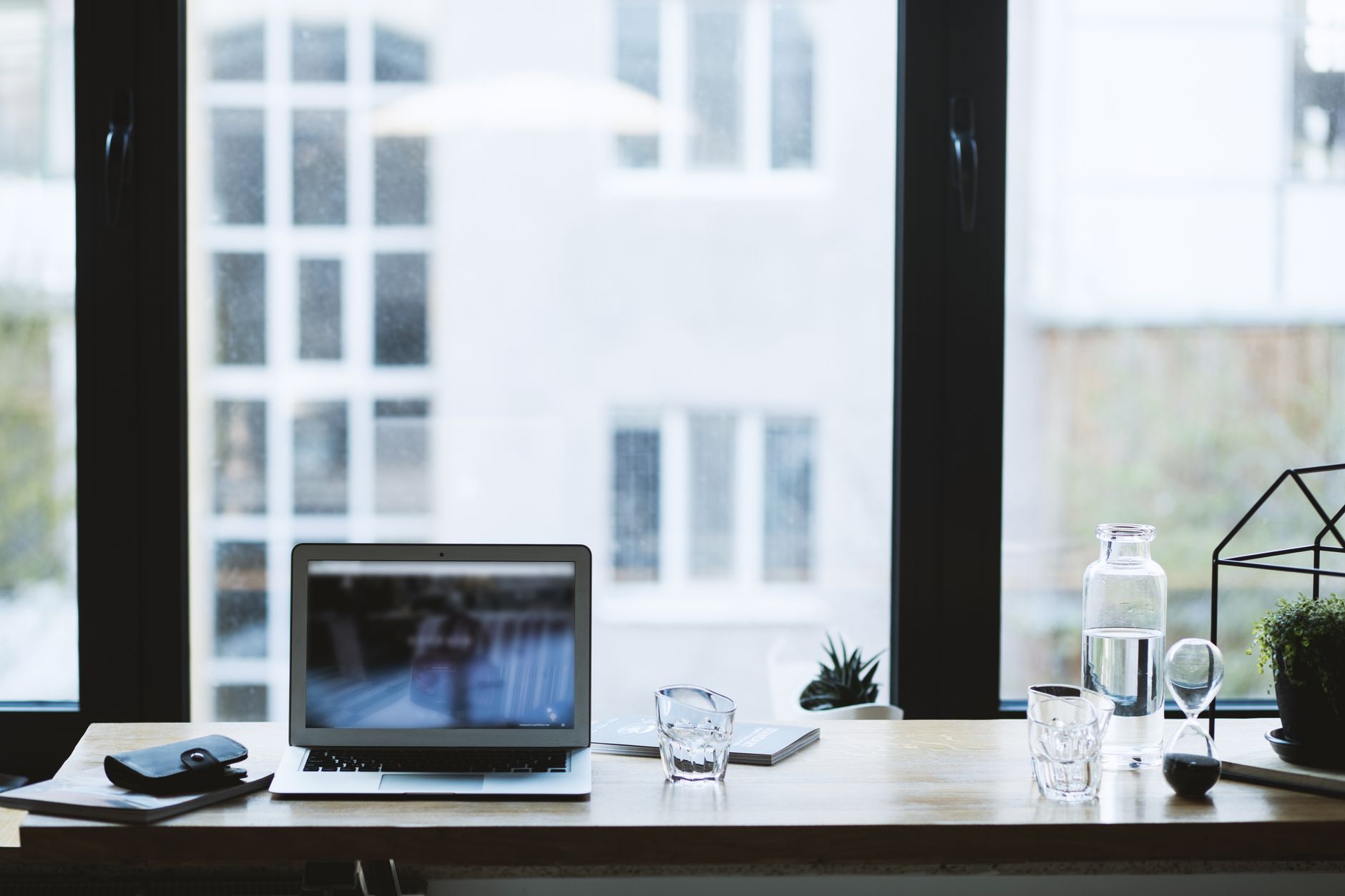 Elevate Your Workspace: Best Standing Desk Converters for 2026 3 A bright, modern office space with various workstations and ergonomic equipment.