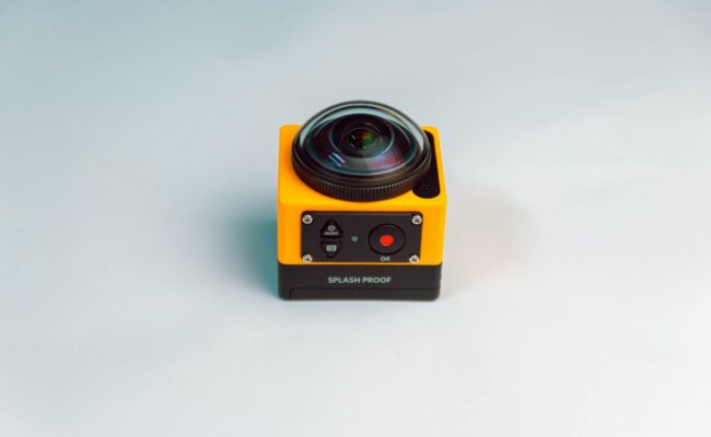 A person holding one of the best action cameras ready to capture adventure