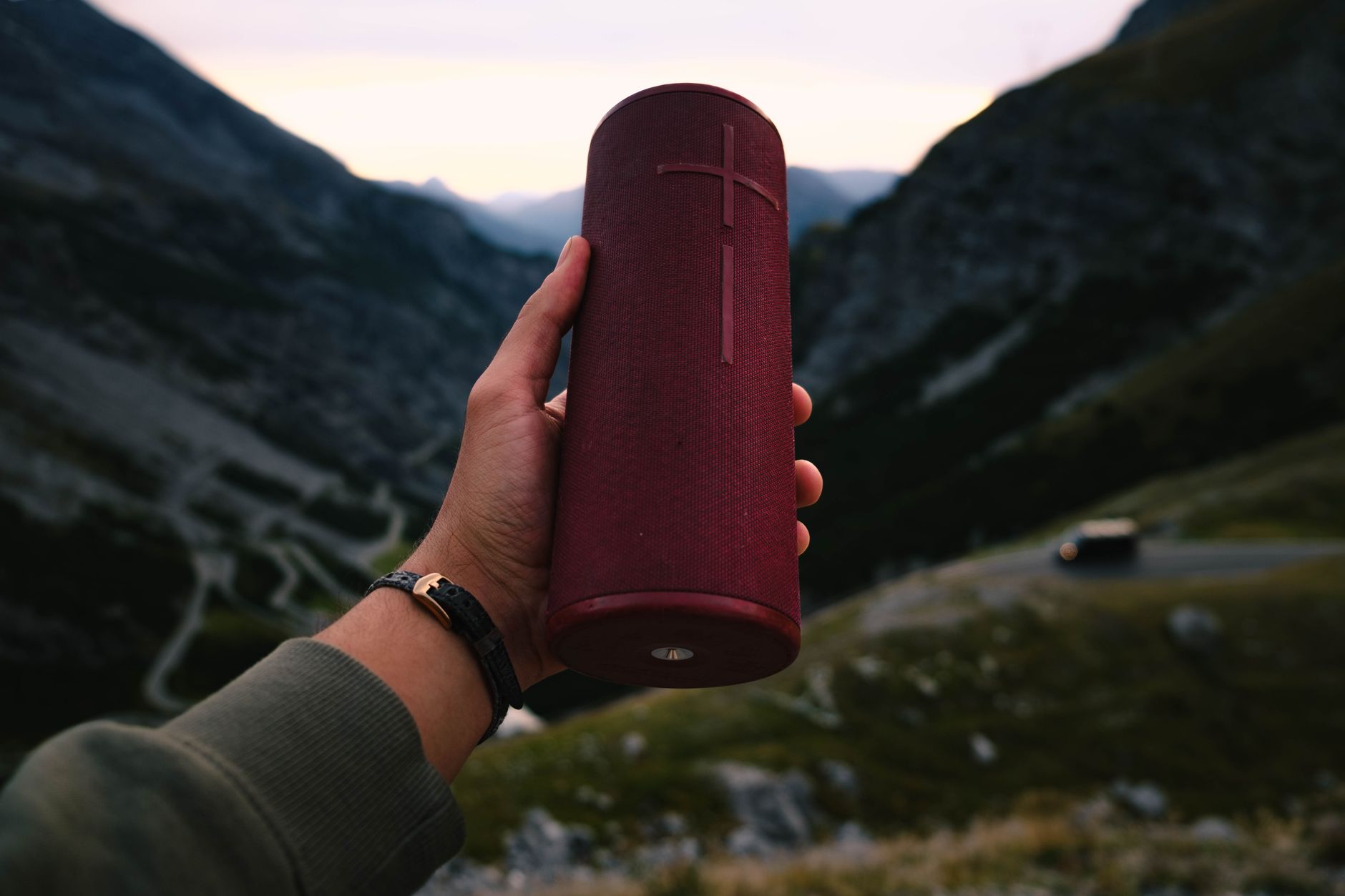 A person enjoying music from the best bluetooth speaker outdoors.