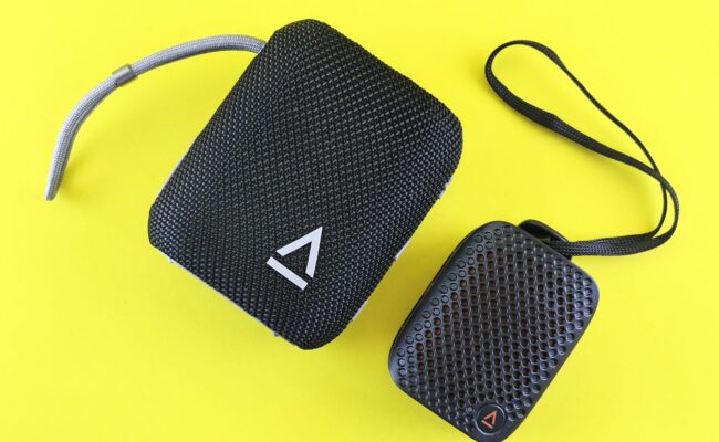 A person enjoying music from the best bluetooth speaker outdoors.