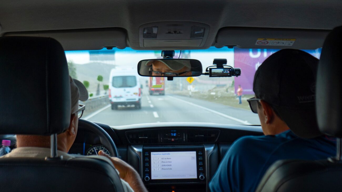 Drive Smarter, Drive Safer: Best Dash Cams for 2026 Reviewed 1 A close-up view of a dash cam mounted on a car windshield, capturing the road ahead, highlighting the importance of the best dash cams for safety.