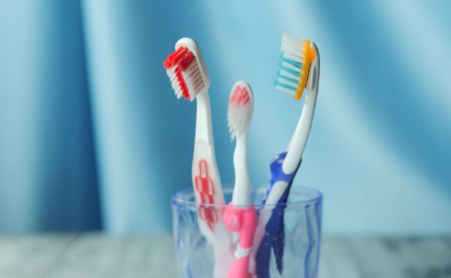 A person using one of the best electric toothbrushes for a clean smile