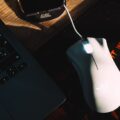 Dominate the Arena: Best Gaming Mice for 2026 22 A close-up of a high-performance best gaming mice on a mouse pad with RGB lighting.