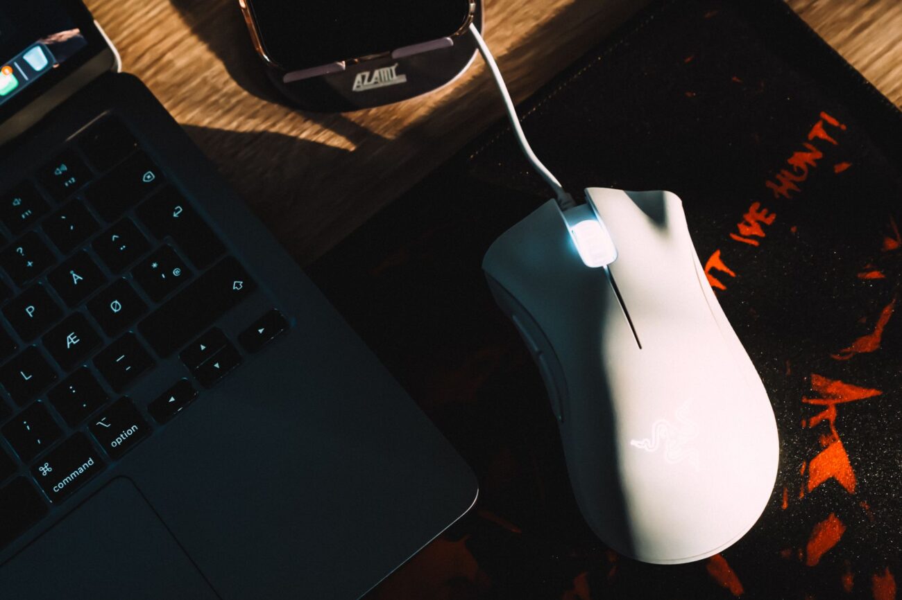 Dominate the Arena: Best Gaming Mice for 2026 1 A close-up of a high-performance best gaming mice on a mouse pad with RGB lighting.