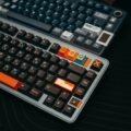 Unlock Peak Performance: The Best Mechanical Keyboards for 2026 24 A person's hands typing on one of the best mechanical keyboards with RGB lighting.