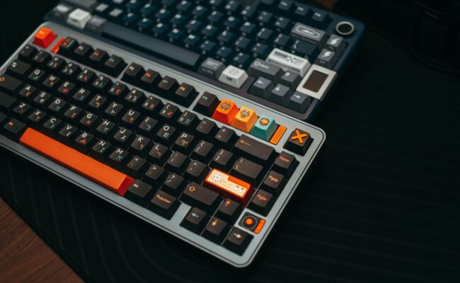 Unlock Peak Performance: The Best Mechanical Keyboards for 2026 1 A person's hands typing on one of the best mechanical keyboards with RGB lighting.