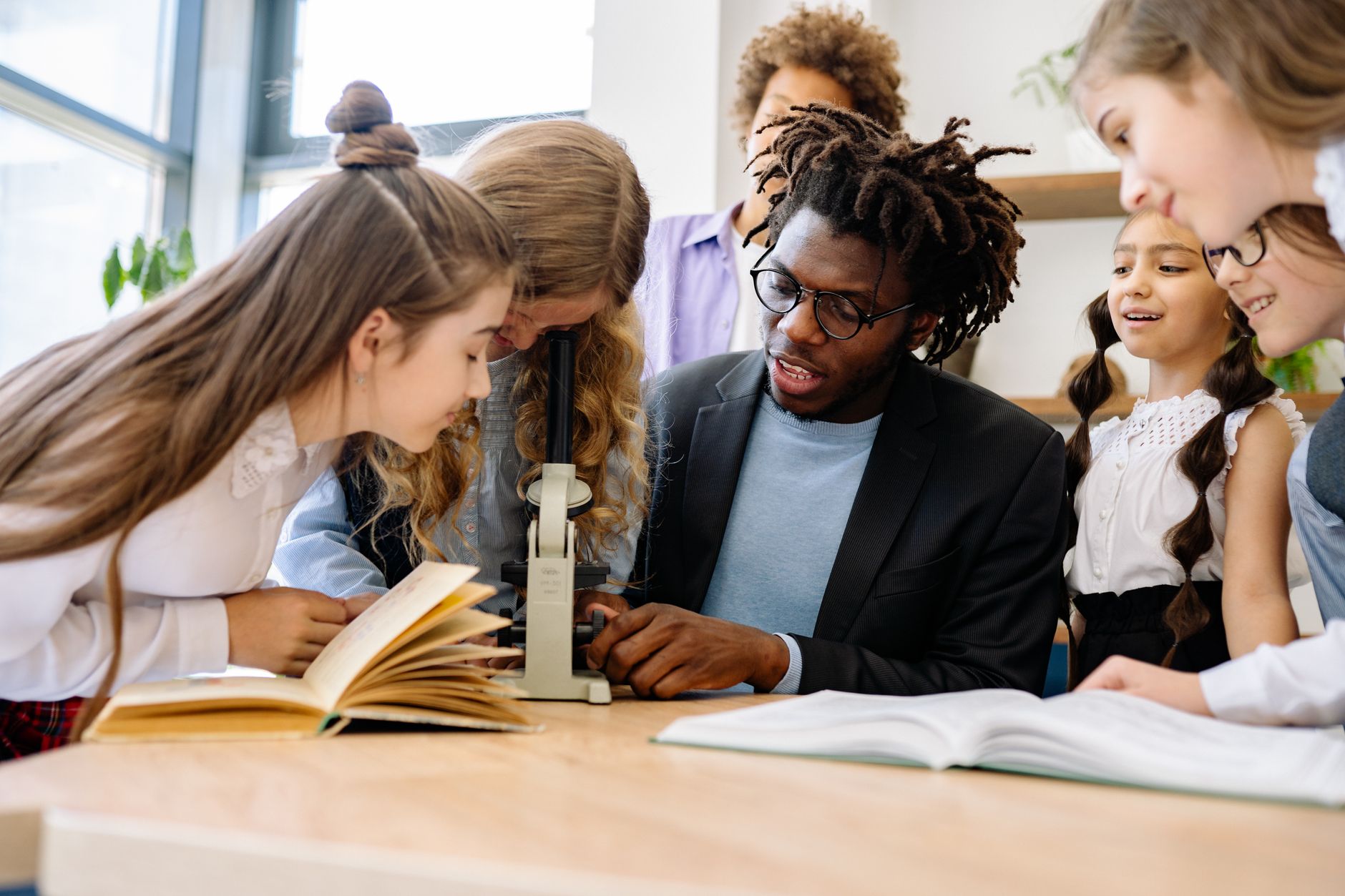 The Best Microscopes for 2026: Top Picks for Every Budget 9 A student focusing a compound microscope during a biology class