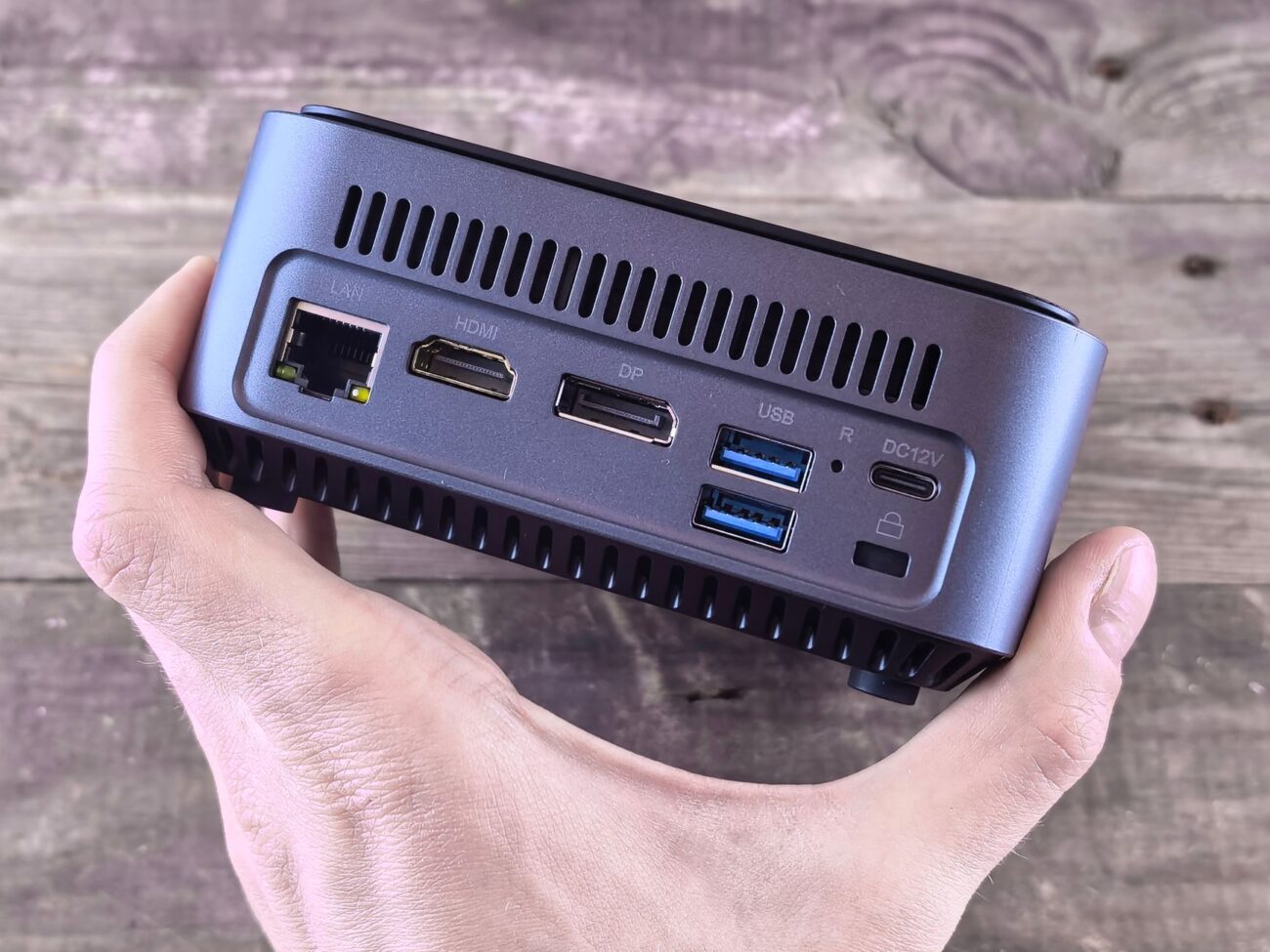 Unleash Power, Save Space: The Best Mini PCs of 2026 1 A sleek desk setup featuring one of the best mini PCs, showing its compact size next to a monitor.