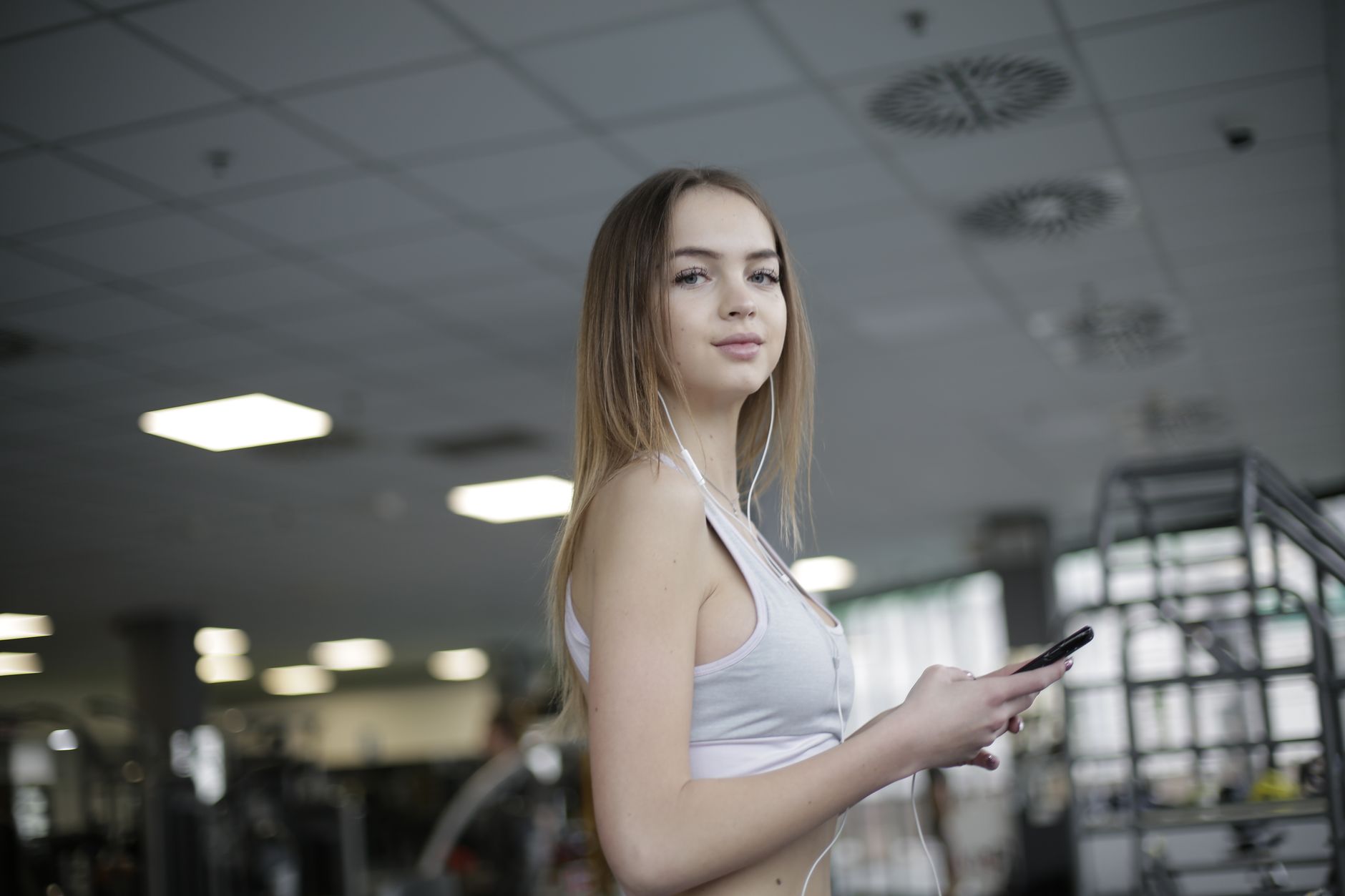 Hear It All: The Best Open Ear Headphones for 2026 Revealed 8 Person working out while wearing open-ear headphones