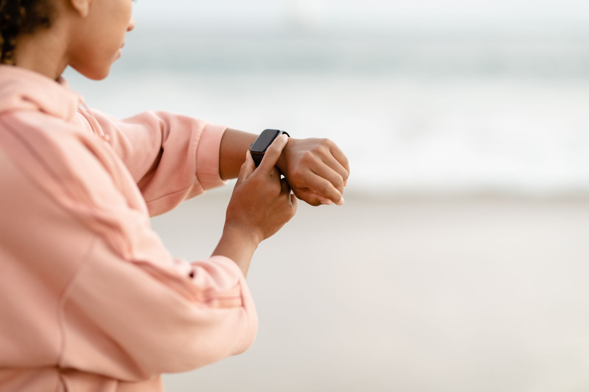 Unlock Your Potential: Best Smart Rings for 2026 Revealed 3 Athlete using wearable technology to track performance and health metrics.