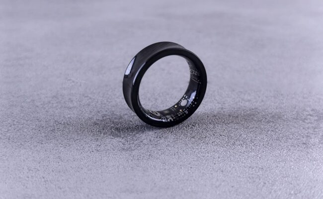 A person wearing a sleek best smart rings on their finger, showcasing its subtle design and advanced technology.
