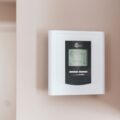 Upgrade Your Home Comfort: Best Smart Thermostats for 2026 24 A sleek smart thermostat on a wall, demonstrating the best smart thermostats for 2026.