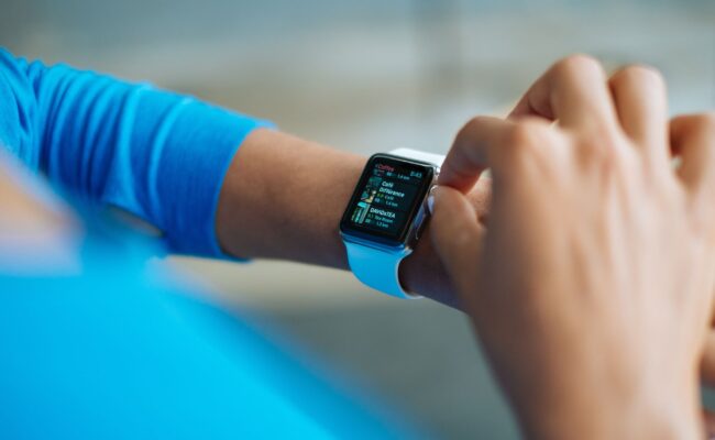 A person checking notifications on the best smartwatches for android