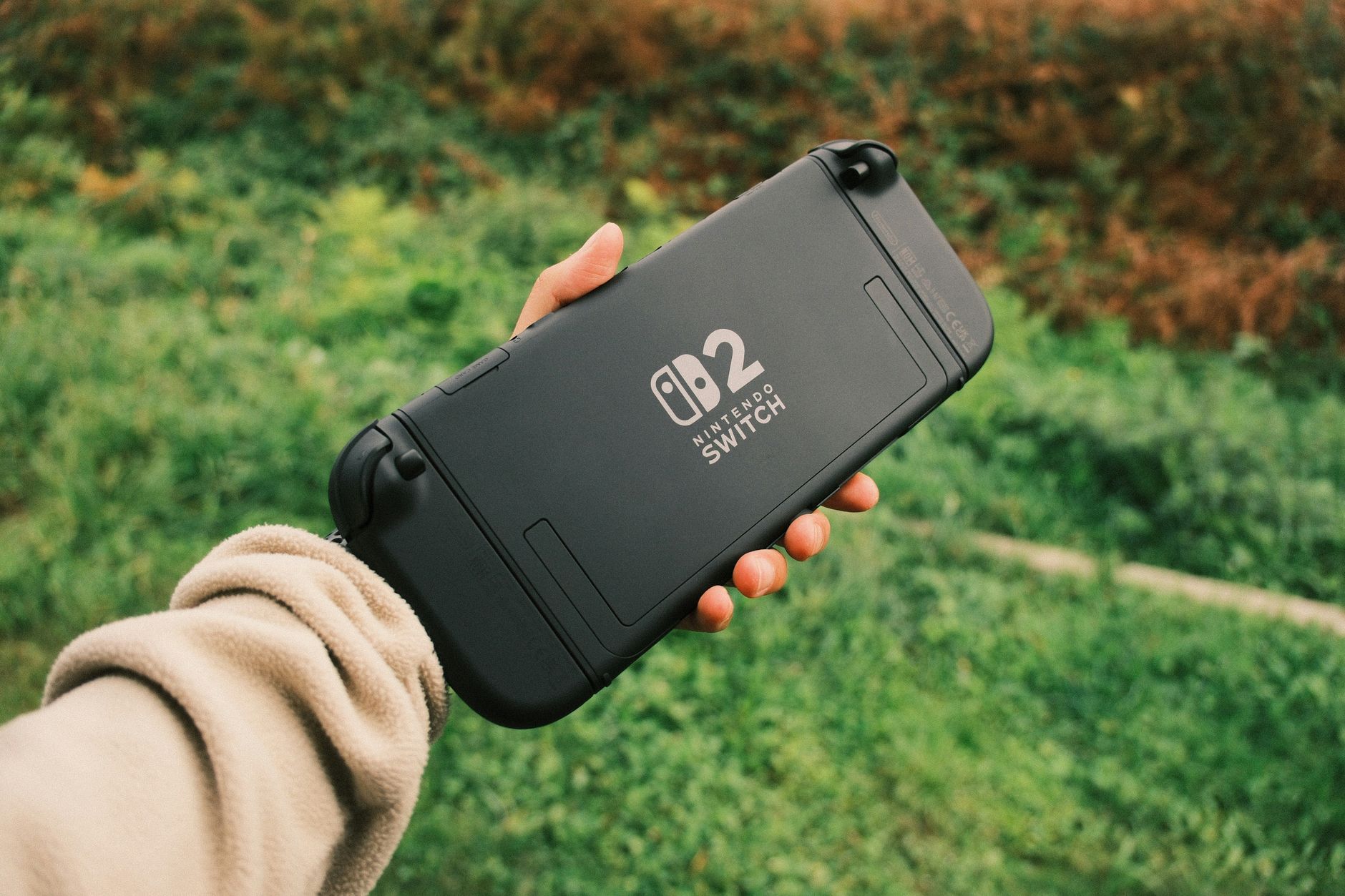 Level Up Your Play: Best Handheld Gaming Consoles for 2026 9 A person enjoying a handheld gaming console while traveling.