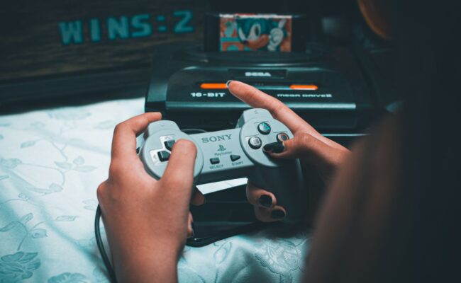 Level Up Your Play: Best Handheld Gaming Consoles for 2026 2 A person intently playing on one of the best handheld gaming consoles.