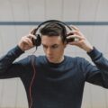 Listen Freely: The Best Open Ear Headphones for 2026 13 A person running outdoors wearing open ear headphones, staying aware of their surroundings.