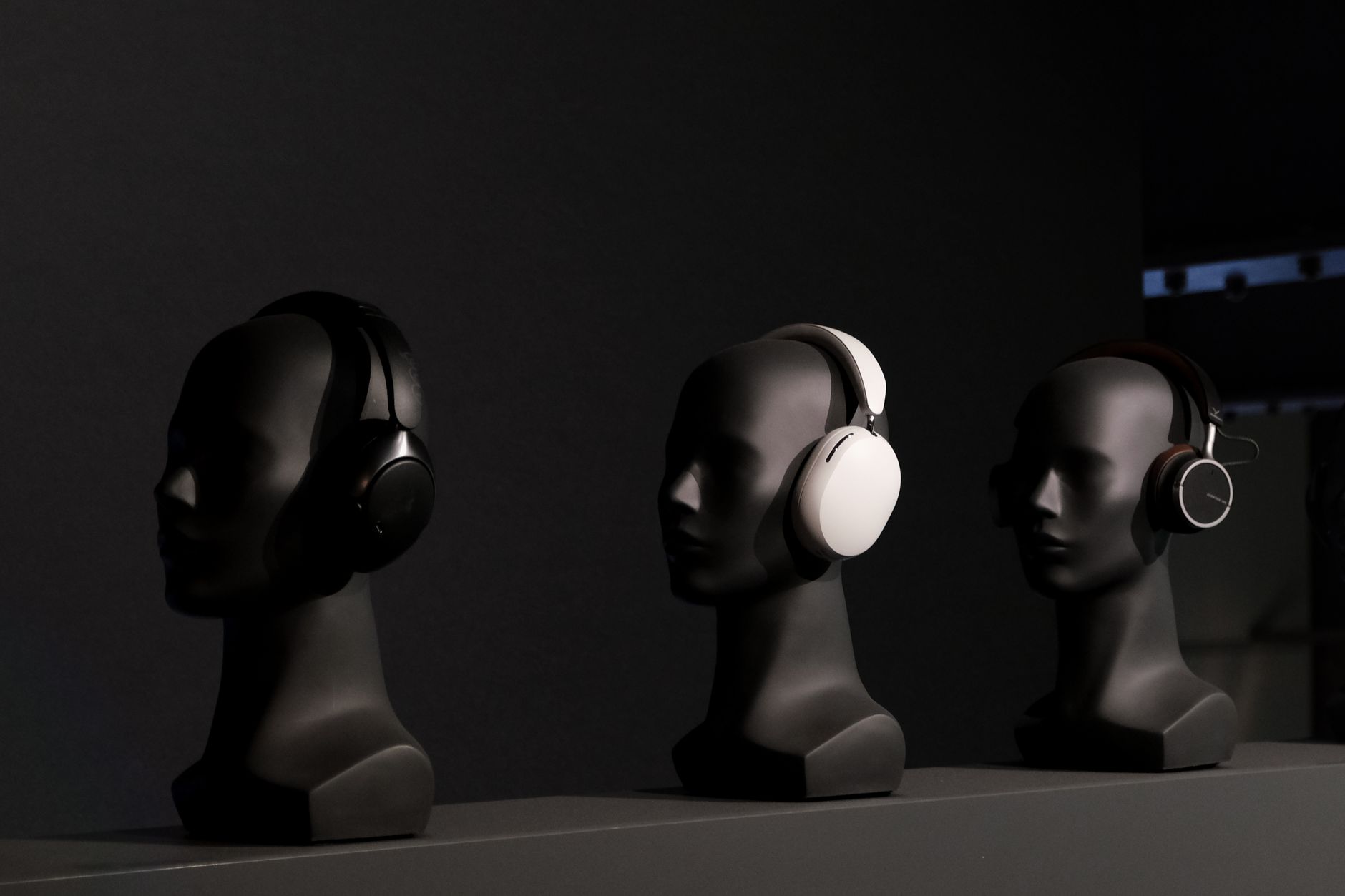 Listen Freely: The Best Open Ear Headphones for 2026 3 A close-up view of different types of open-ear headphones laid out on a table.
