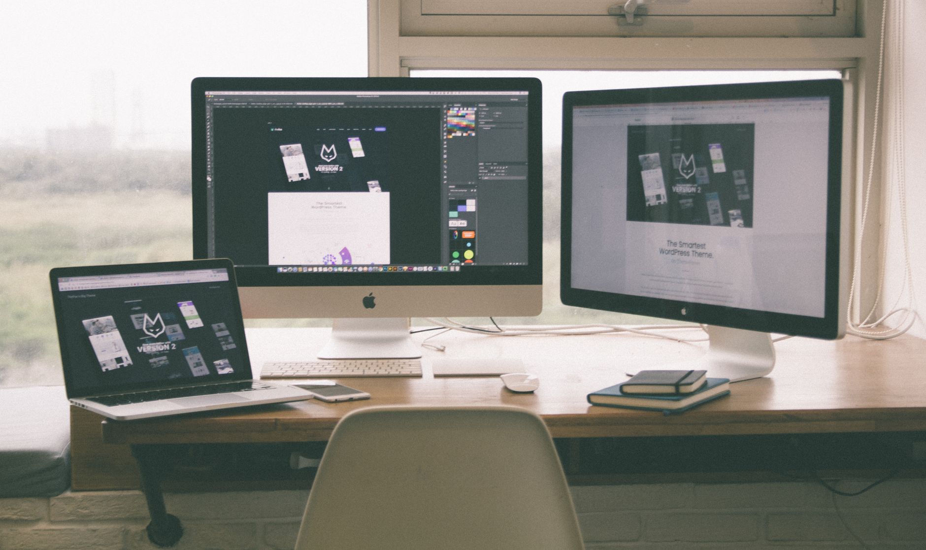 A person working with two portable monitors setup, showcasing the versatility of portable monitors.