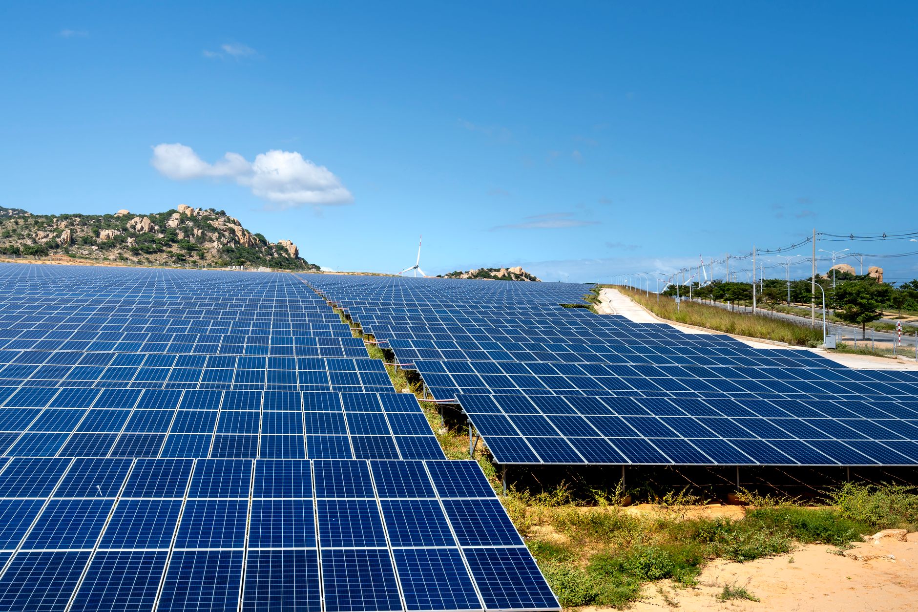 Power Up Anywhere: Best Portable Power Stations for 2026 3 Several portable power stations connected to solar panels, demonstrating off-grid charging capabilities.