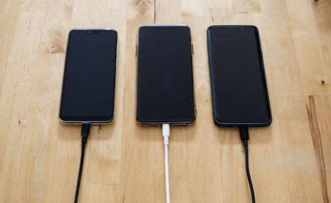 A portable power station charging devices in a camping setup, highlighting the best portable power stations.