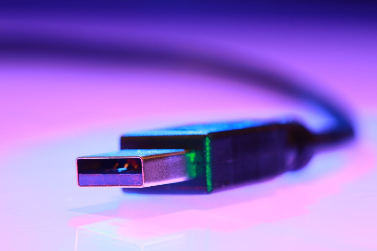 A sleek portable SSD connected to a laptop, representing the best portable SSD for fast data transfer.