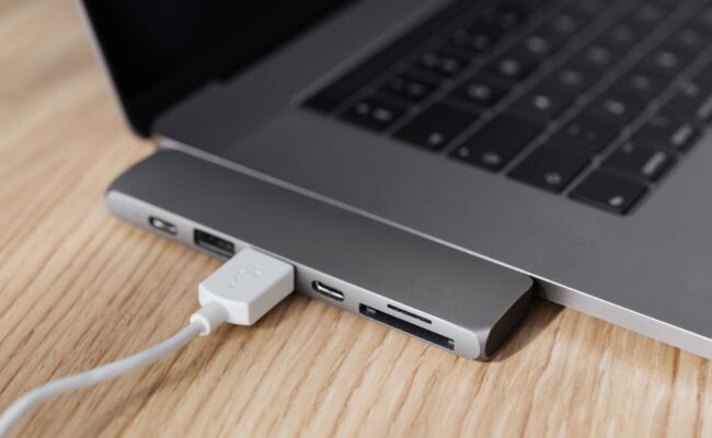 Power Up Your Productivity: Best USB-C Hubs for Laptops in 2026 26 A sleek laptop connected to a powerful usb-c hubs for laptops, enhancing productivity.