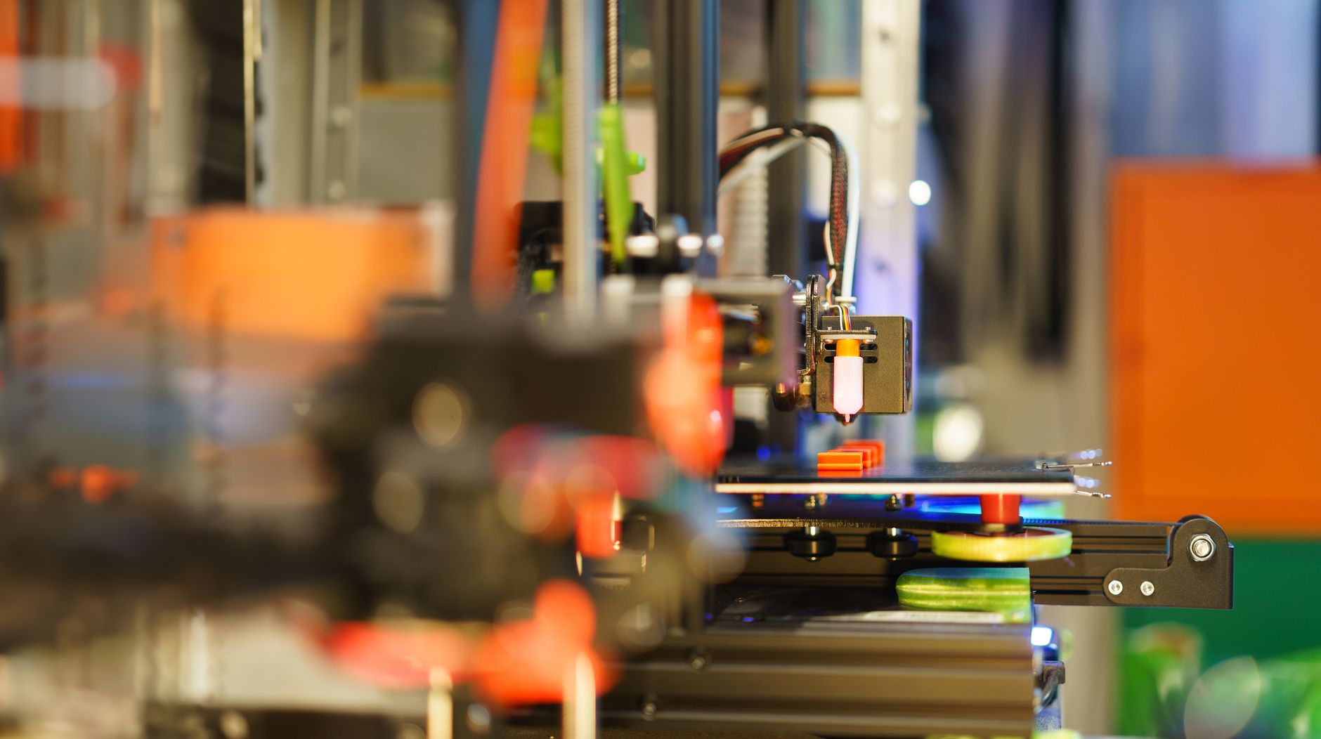 The Best 3D Printers for Beginners in 2026: Your Ultimate Guide 9 A person carefully assembling a component of a 3D printer.