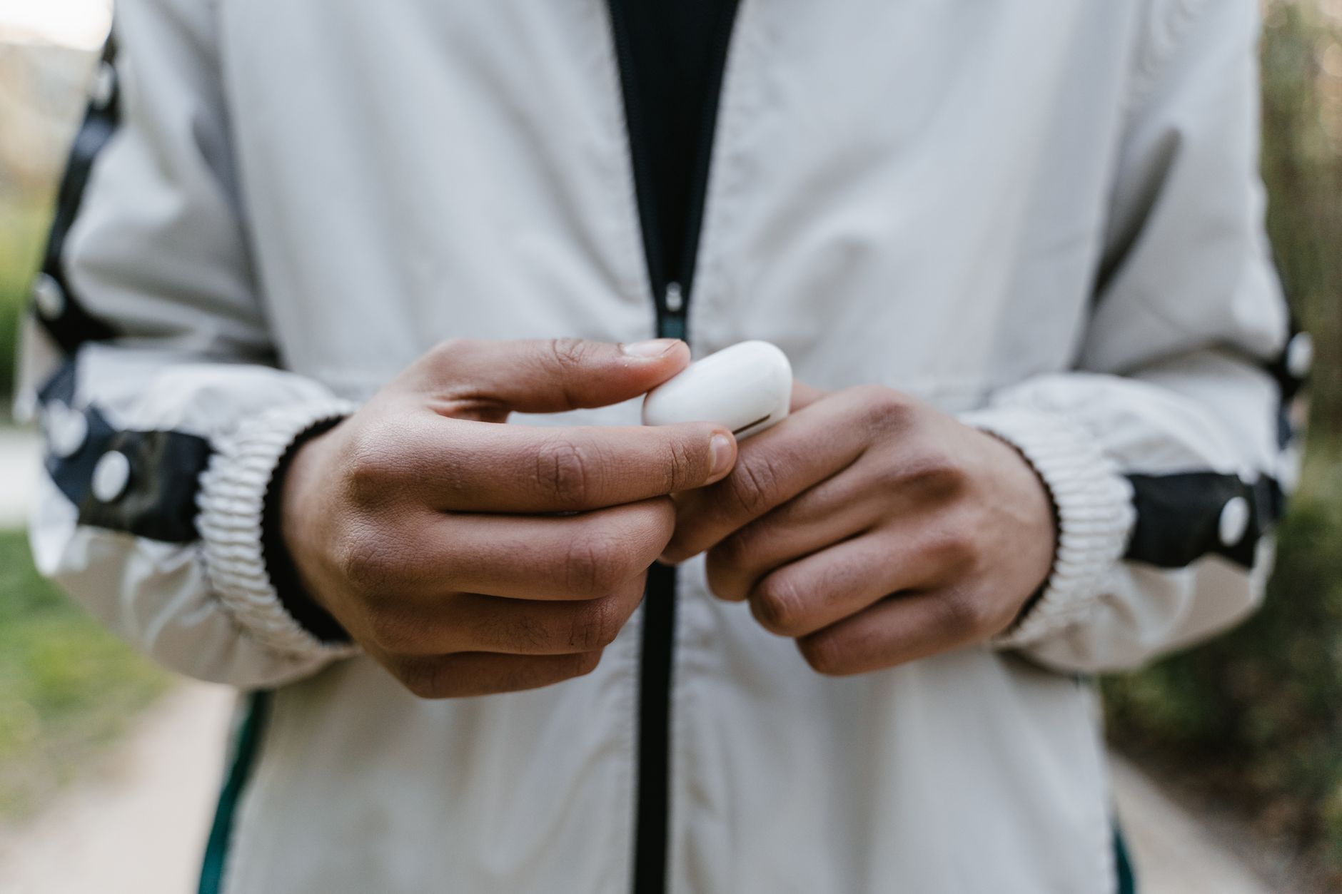 AirPods Ultra Reportedly Set for Launch Next Month 2 person wearing wireless earbuds during airpods ultra launch news