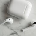 AirPods Ultra Reportedly Set for Launch Next Month 10 person wearing wireless earbuds during airpods ultra launch news