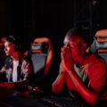 A gamer sitting comfortably in one of the best gaming chairs, focused on their screen.