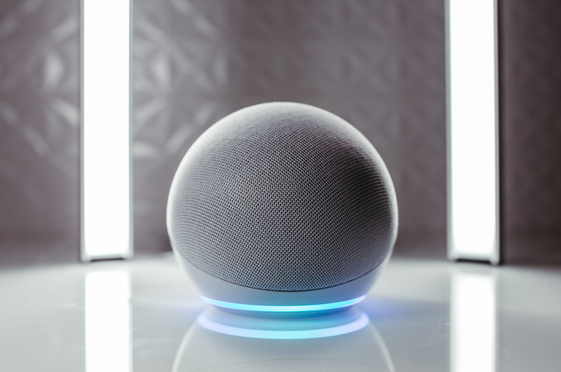 OpenAI Reportedly Developing Screen-Free ChatGPT Smart Speaker for 2027 2 A futuristic chatgpt smart speaker concept with glowing light and minimal design.