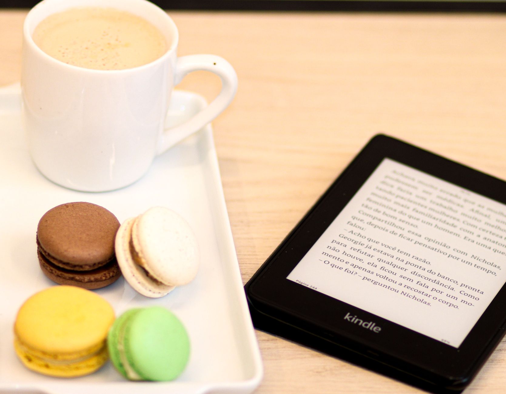 E-Reader vs Kindle: Which Device Fits Your Reading Style? 7 Electronic reading tablet resting next to a cup of warm coffee