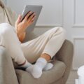 E-Reader vs. Tablet: Which Should You Buy? 19 A person comparing an e-reader vs. tablet side by side, highlighting the differences in screen technology.