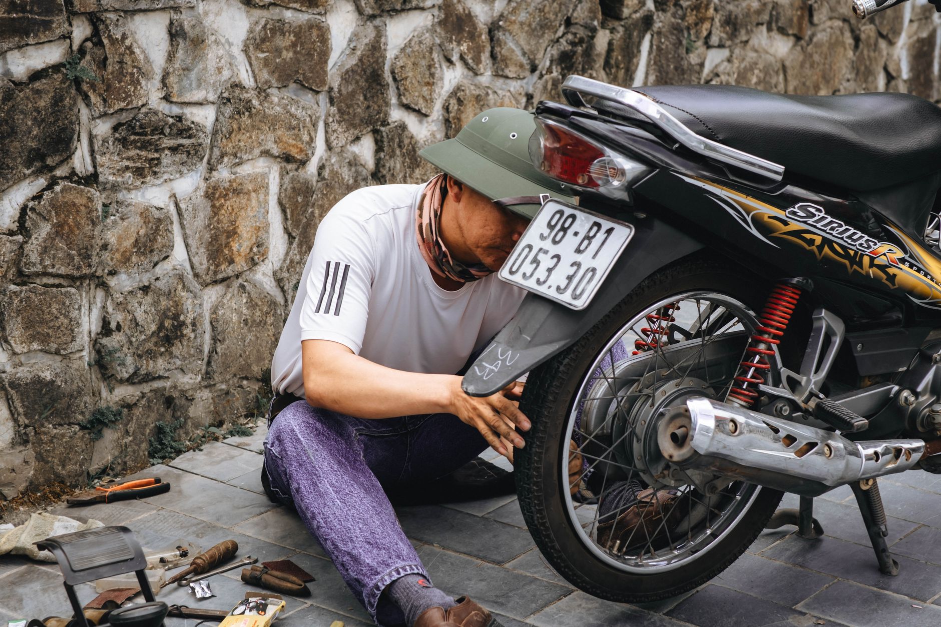 Why Is Your Electric Scooter Turning Off? Causes & Easy Fixes 2 Technician troubleshooting an electric scooter turning off issue