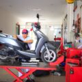Why Is Your Electric Scooter Turning Off? Causes & Easy Fixes 6 Technician troubleshooting an electric scooter turning off issue