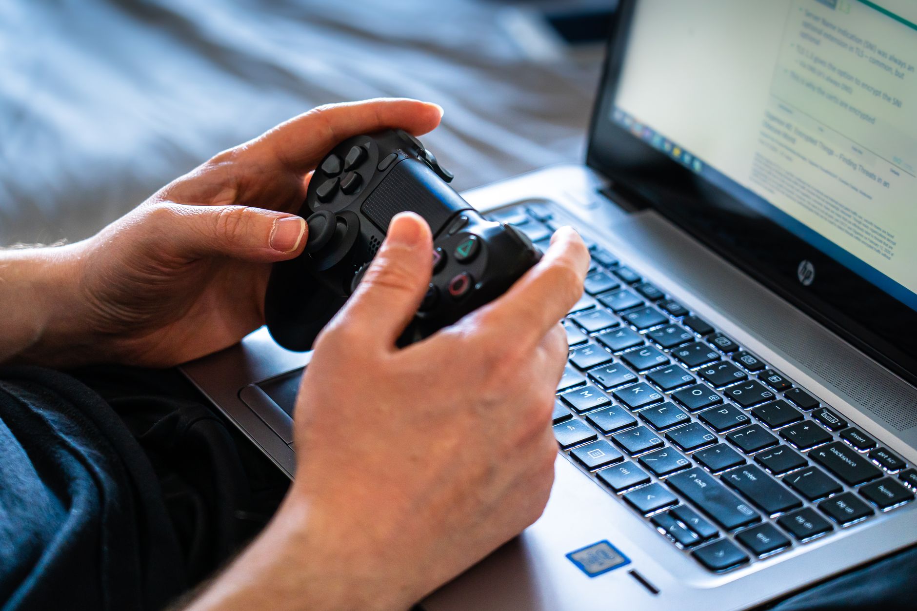Gaming Handheld vs. Laptop: Which Should You Buy for Portable Power? 2 Side-by-side comparison of a gaming handheld vs laptop, illustrating their size difference.