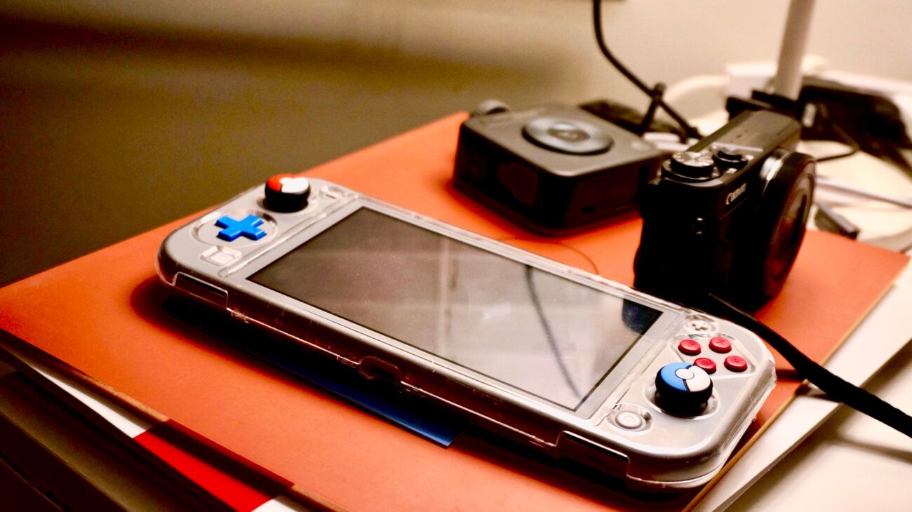 Gaming Handheld vs. Laptop: Which Should You Buy for Portable Power? 1 Side-by-side comparison of a gaming handheld vs laptop, illustrating their size difference.