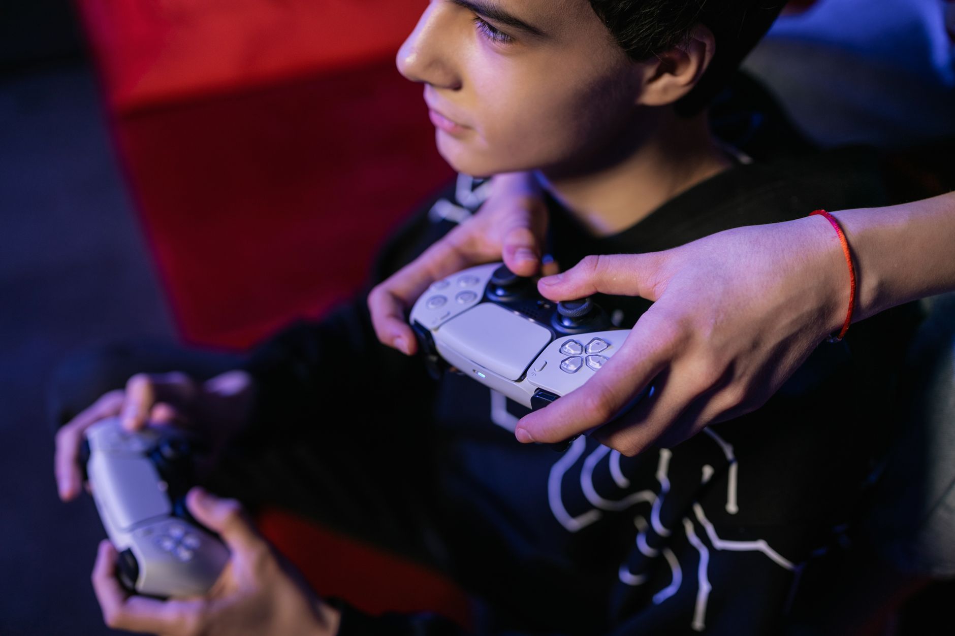A gamer enjoying a handheld gaming PC, comparing handheld gaming pc vs laptop.