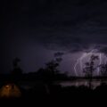 Portable power stations - A family enjoying the outdoors with a portable power station charging devices.
