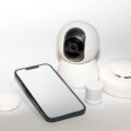 A front door with a ring doorbell vs security camera monitoring the entrance.
