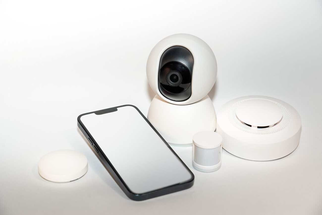 A front door with a ring doorbell vs security camera monitoring the entrance.