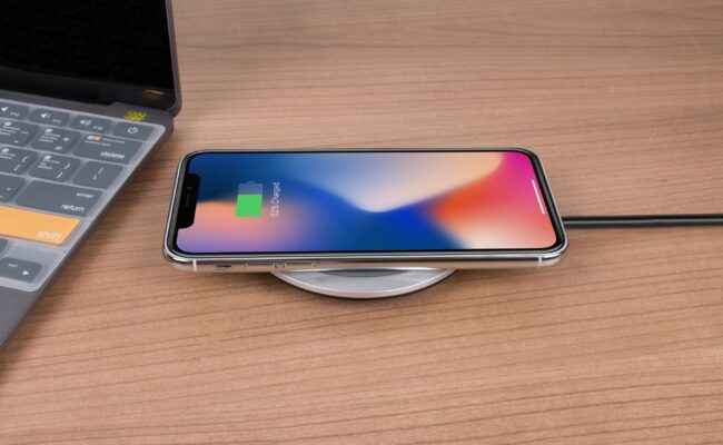 The Best Wireless Chargers for iPhone in 2026: Fast & Reliable 3 A sleek desk setup featuring wireless chargers for iphone