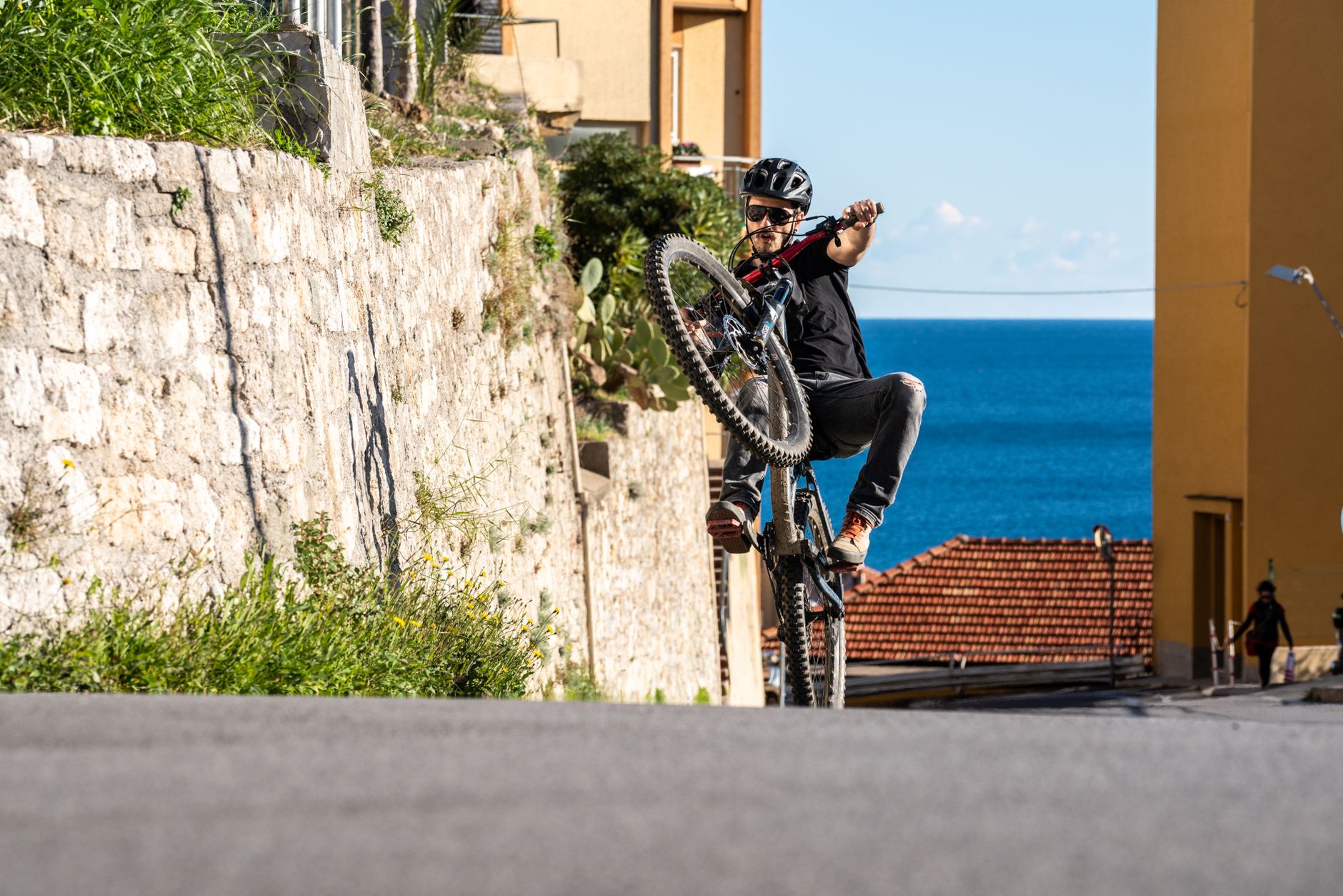 Capture Every Thrill: Best Action Cameras for 2026 3 A mountain biker wearing an action camera on their helmet.