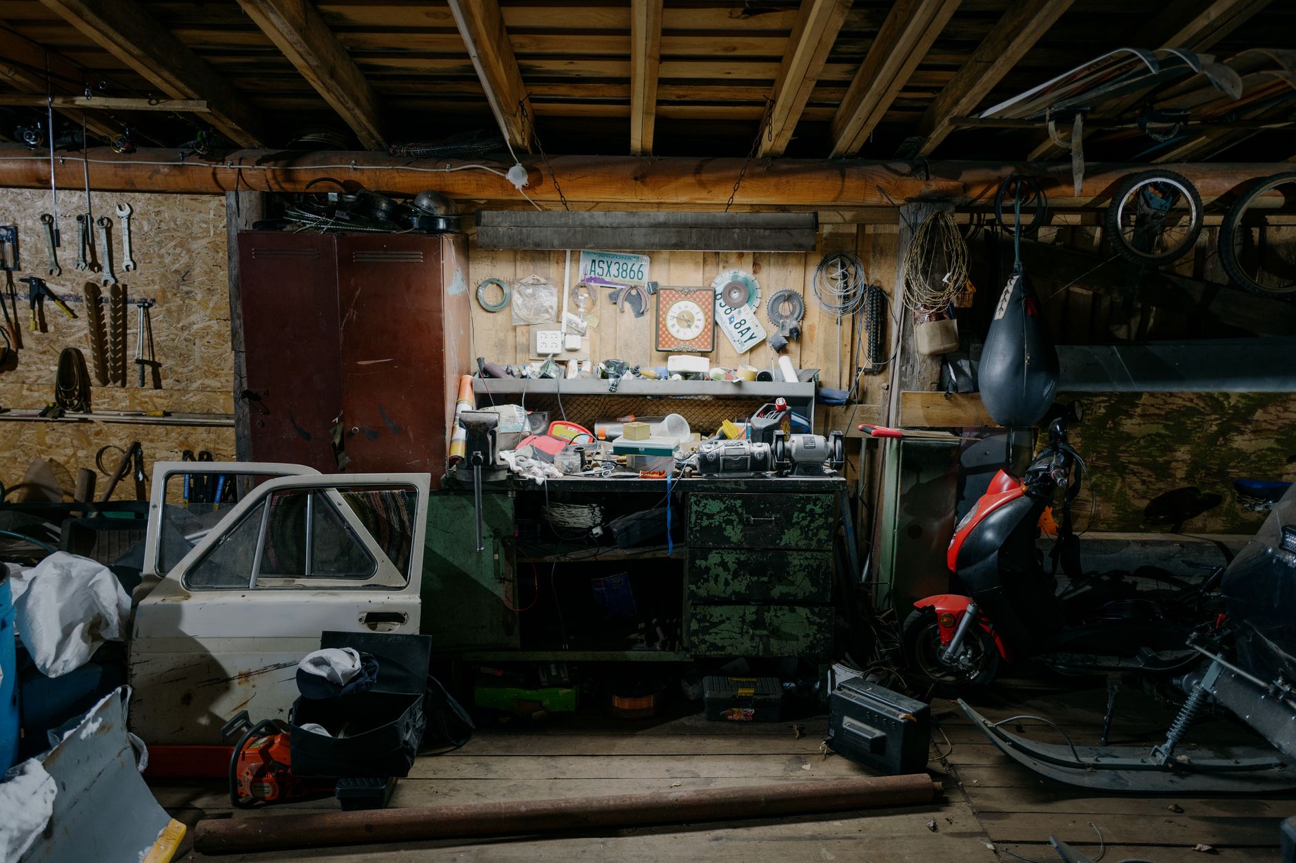How to Fix Common Electric Scooter Problems: Throttle, Battery, and Charging Port 2 A person using tools to fix common electric scooter problems on a workbench.