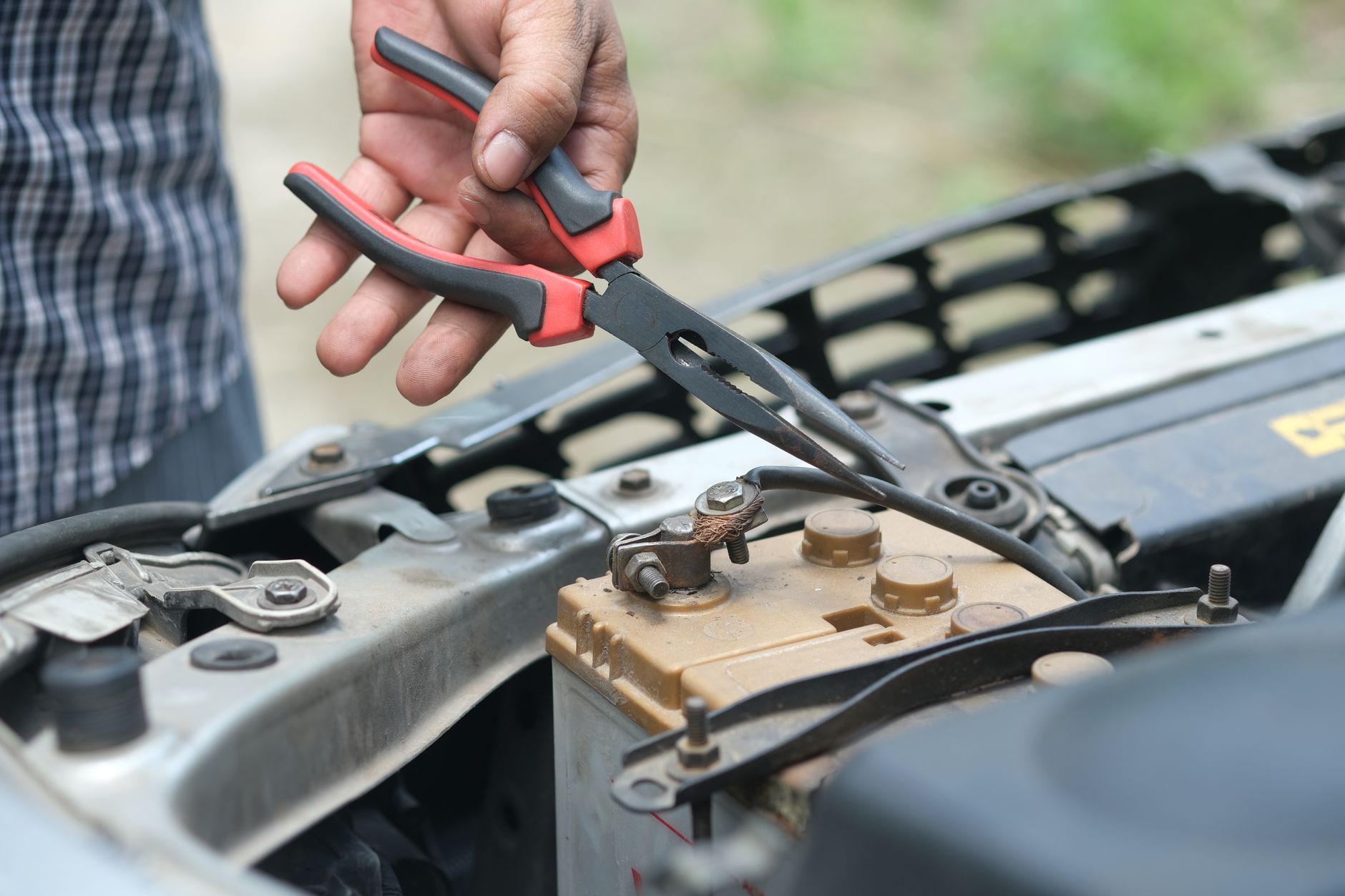 How to Fix Common Electric Scooter Problems: Throttle, Battery, and Charging Port 3 Close-up of an electric scooter battery being tested.