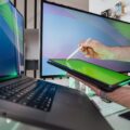Portable monitors - A person working remotely with a portable monitor setup, enhancing productivity.