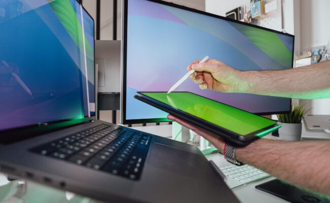 The Best Portable Monitors for 2026: Your Ultimate Mobile Display Guide 1 Portable monitors - A person working remotely with a portable monitor setup, enhancing productivity.