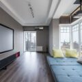 Projector vs. TV: Which Big Screen Display Should You Buy? 8 Comparing a modern home theater projector vs tv screen setup
