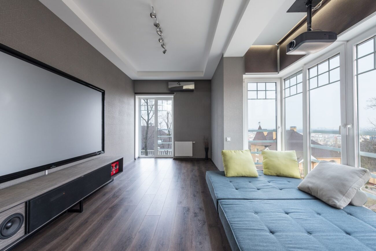 Comparing a modern home theater projector vs tv screen setup